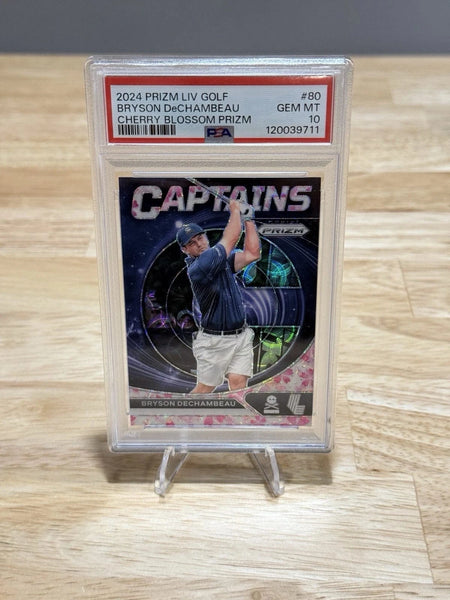 Tour Quality Golf's Shop 2024 Prizm LIV Golf 80 Bryson DeChambeau Captains Cherry Blossom /27 PSA 10