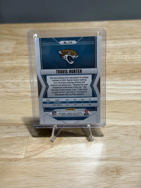 Tour Quality Golf's Shop 2025 Donruss Elite #114 Travis Hunter Status Explosion /999 Rookie RC