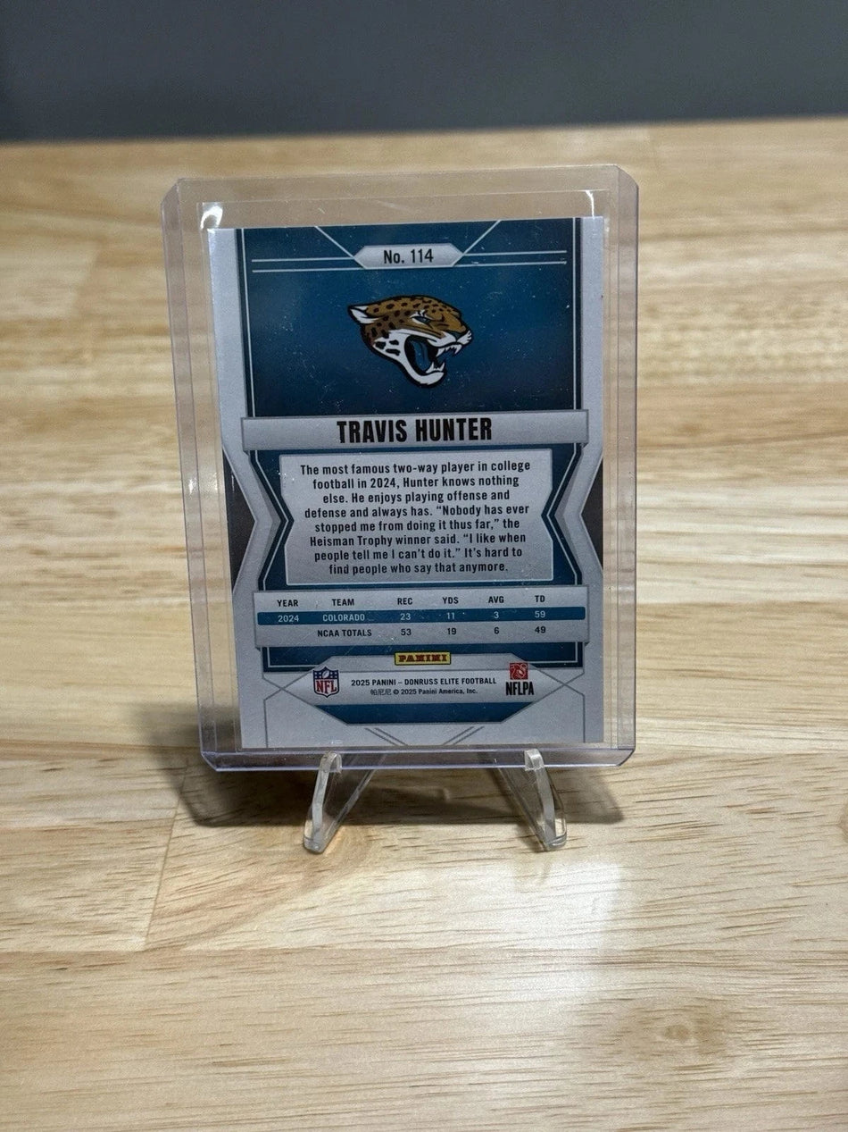 Tour Quality Golf's Shop 2025 Donruss Elite #114 Travis Hunter Status Explosion /999 Rookie RC